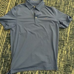 Like new vineyard vines golf shirt. Blue with white stripe. Size M